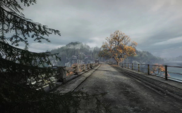 HD PC desktop wallpaper from the video game The Vanishing of Ethan Carter: misty bridge leading to a lone autumn tree and distant village under a cloudy sky.