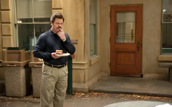 Ron Swanson from Parks and Recreation holding a sandwich, a perfect HD wallpaper for fans of the show.