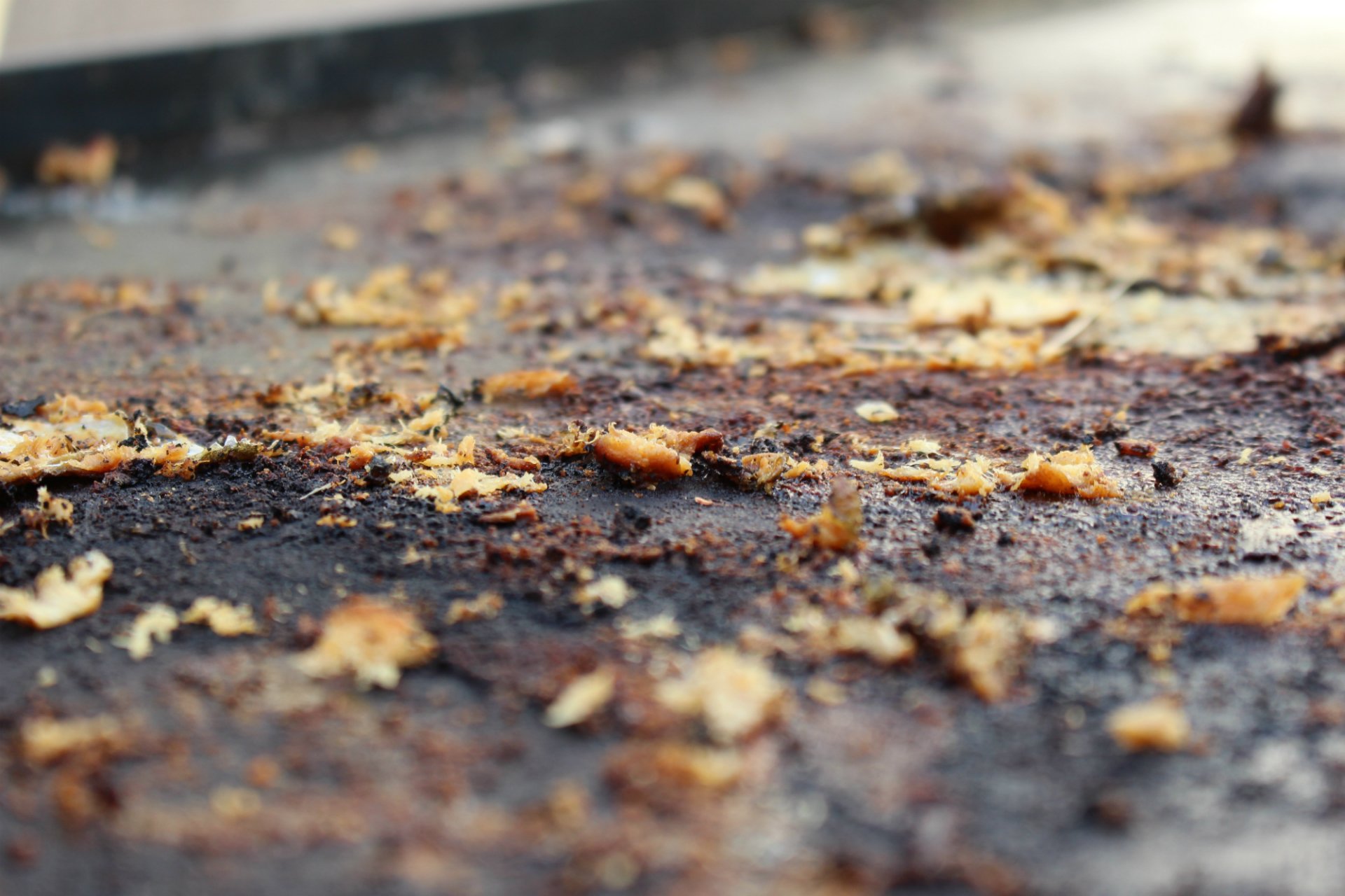 HD desktop wallpaper of food remnants on a grill, showcasing textures and details for a culinary background theme.