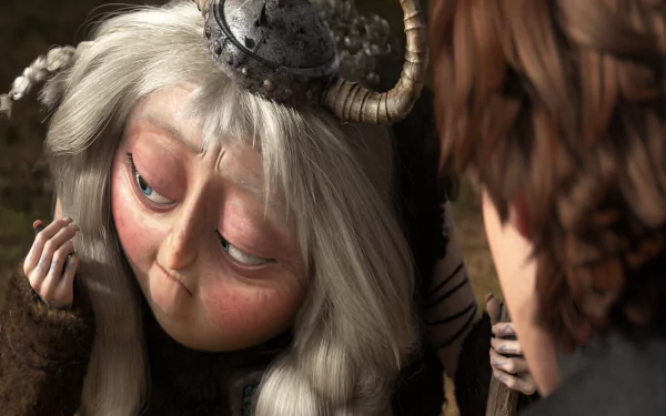HD PC desktop wallpaper from the movie How to Train Your Dragon 2: close-up of Valka in a horned helmet gazing down, with Hiccup’s profile at the right.