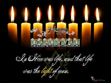 HD PC desktop wallpaper featuring glowing Hanukkah candles and the message Happy Hanukkah with a holiday-themed quote celebrating the light of men.