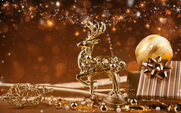 HD desktop wallpaper featuring a golden Christmas theme with a sparkling reindeer, gift box, and ornaments against a bokeh light background.