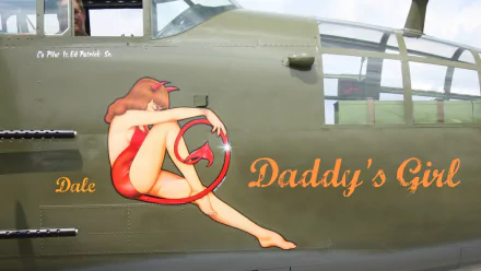 Military aircraft nose art on olive-drab fuselage: pin-up in a red swimsuit inside a red circle, captioned Daddy's Girl with Dale near the cockpit — HD PC desktop wallpaper background.