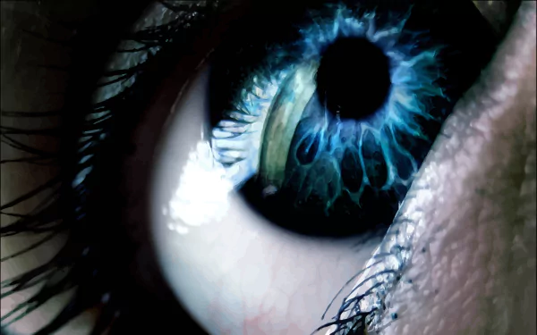 A close-up of a woman's eye, showcasing intricate details and vibrant blue hues, serves as a captivating HD desktop wallpaper and background.