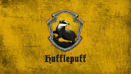 HD desktop wallpaper featuring the Hufflepuff House crest, with a badger on a gold background, inspired by the Harry Potter movie series.
