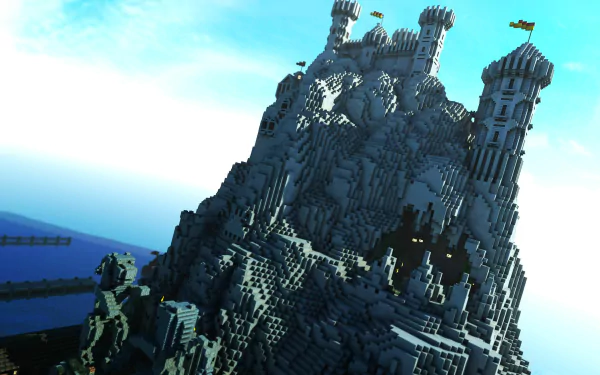 HD desktop wallpaper of a Minecraft scene featuring an intricate castle built atop a mountain with a bright blue sky in the background.