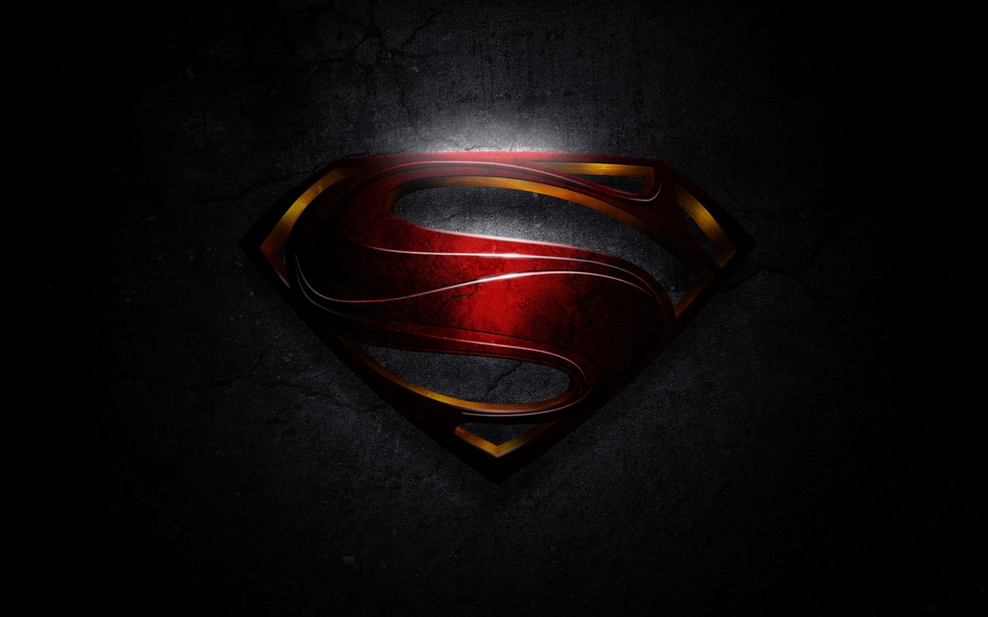 HD desktop wallpaper featuring the iconic Superman logo with a metallic finish, set against a dark, textured background.