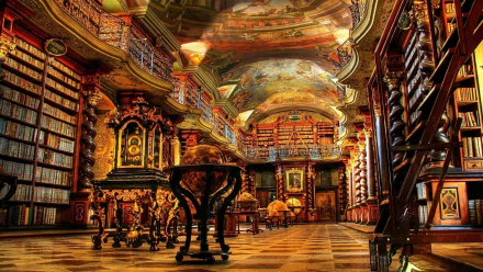 HD desktop wallpaper featuring the ornate interior of Cambridge University Library, showcasing intricate woodwork, bookshelves, and a painted ceiling.