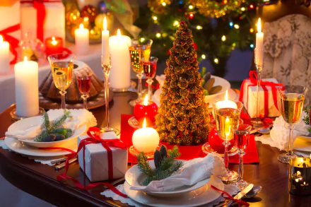 A beautifully decorated Christmas table, featuring candles, champagne glasses, and a festive centerpiece. This 4K Ultra HD wallpaper captures the holiday spirit and joyful celebration.