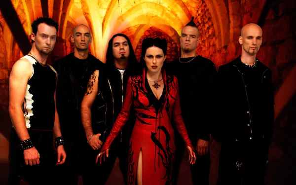 HD PC desktop wallpaper: Within Temptation in a red-lit gothic archway, lead singer in a red coat with five bandmates, dramatic symphonic metal vibe.