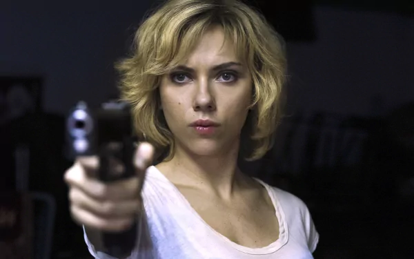 Scarlett Johansson in a scene from the movie Lucy, holding a gun with a determined expression, featured in a 4K Ultra HD PC desktop wallpaper.