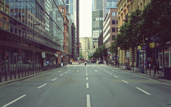 4K Ultra HD view of a man-made urban street in Frankfurt, Germany, showcasing modern buildings and a clear, empty roadway.