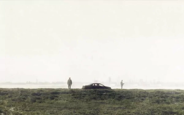 HD desktop wallpaper featuring a foggy landscape with two figures and a car, inspired by the TV show True Detective.