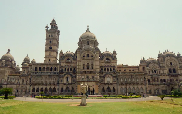HD desktop wallpaper of the man-made Laxmi Vilas Palace in Vadodara, showcasing its grand architecture under a clear sky.