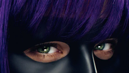 Close-up HD wallpaper of Hit-Girl from the movie Kick-Ass, featuring Chloë Grace Moretz’s intense eyes framed by purple hair and her black mask.