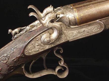 Close-up HD desktop wallpaper of an intricately engraved man-made shotgun with ornate metalwork and detailed craftsmanship on a dark background.