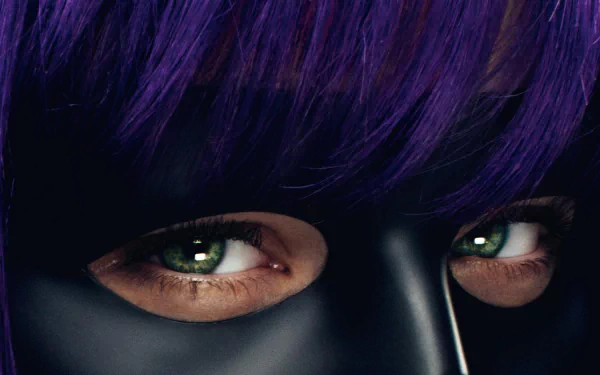 Close-up HD wallpaper of Hit-Girl from the movie Kick-Ass, featuring Chloë Grace Moretz’s intense eyes framed by purple hair and her black mask.