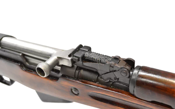 Close-up HD desktop wallpaper of a man-made SKS rifle showcasing the receiver and wooden stock details.