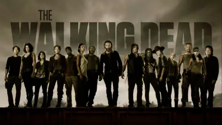 HD desktop wallpaper featuring the main cast of The Walking Dead, including characters Rick Grimes, Michonne, and Carl Grimes, with the show’s title prominently displayed in the background.