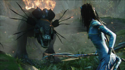 HD PC desktop wallpaper featuring a scene from the movie Avatar, showing a Na'vi character facing a fiery, menacing creature in a lush forest setting.