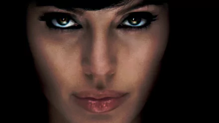 Close-up of Angelina Jolie's intense face from the movie Salt, rendered in 4K Ultra HD for a striking PC desktop wallpaper.