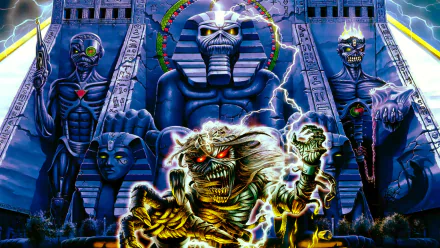 A vibrant Iron Maiden-themed HD desktop wallpaper featuring striking artwork of the band’s iconic mascot alongside mystical figures and dramatic lightning effects.