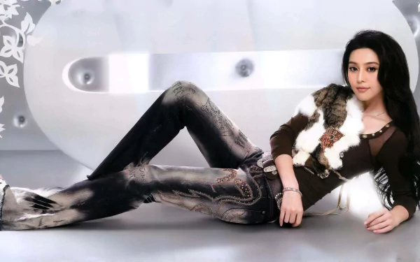HD PC desktop wallpaper featuring celebrity Fan Bingbing reclining confidently in stylish attire against a modern, minimalistic background.