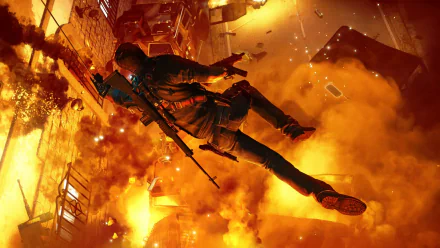 Rico Rodriguez from Just Cause 3 leaps through a fiery explosion in this HD PC desktop wallpaper from the popular video game.