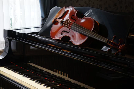 A close-up of a polished piano with a violin resting on it, capturing the elegance of music in a serene setting. This 4K Ultra HD wallpaper highlights the beauty of musical instruments.