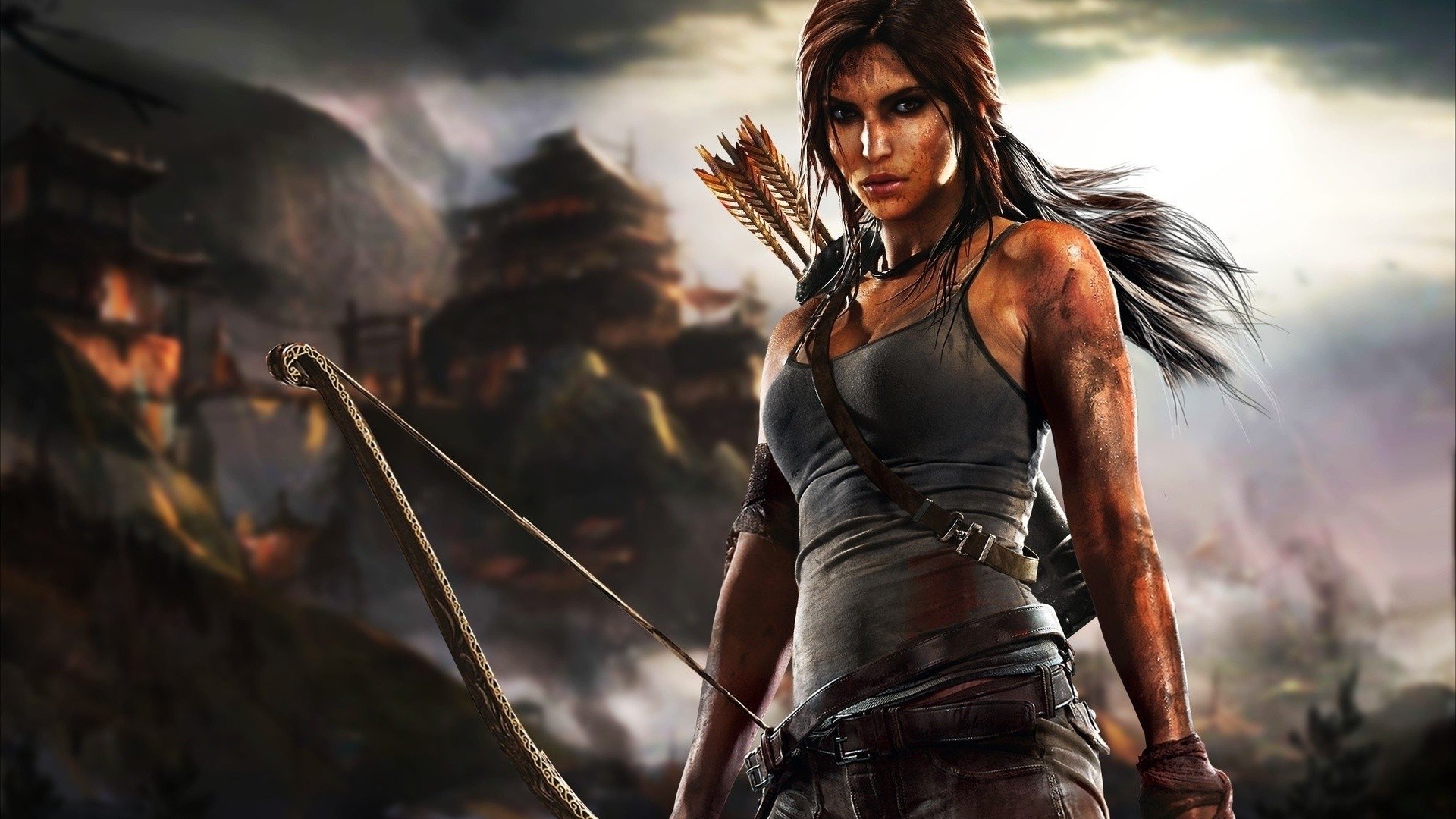 HD PC desktop wallpaper featuring Lara Croft from the Tomb Raider video game, holding a bow with a dramatic, mountainous background.