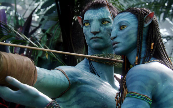 A stunning HD wallpaper featuring Neytiri from the movie Avatar, showcasing her striking features alongside a companion in a lush, vibrant jungle setting.