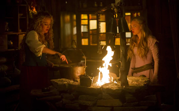 Amanda Seyfried in a dimly lit scene from the movie Red Riding Hood, featured in a 4K Ultra HD PC desktop wallpaper and background.