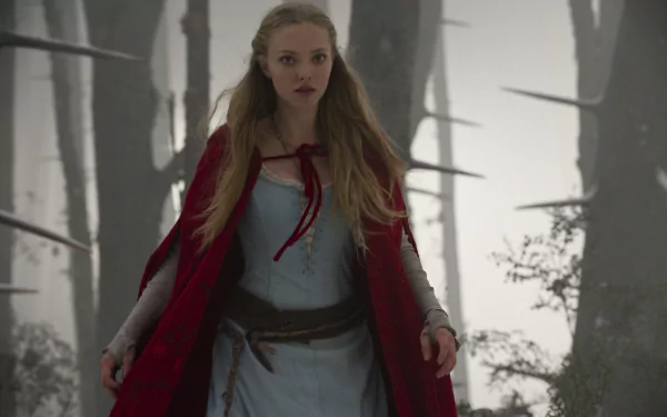 Amanda Seyfried as Red Riding Hood in a misty forest, featured in a 4K Ultra HD movie desktop wallpaper.