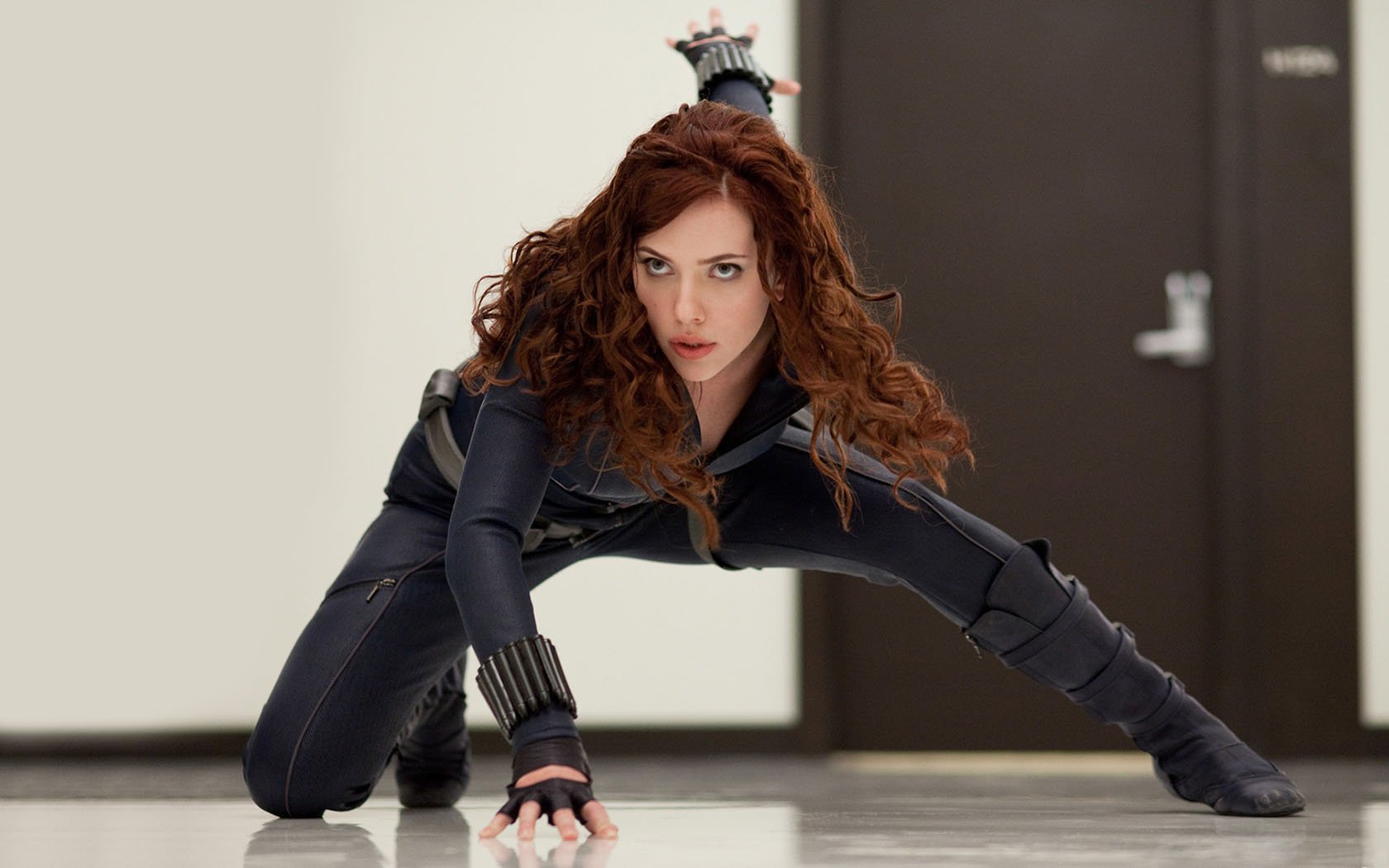 Black Widow in action pose from Iron Man 2, featured as an HD PC desktop wallpaper and background.