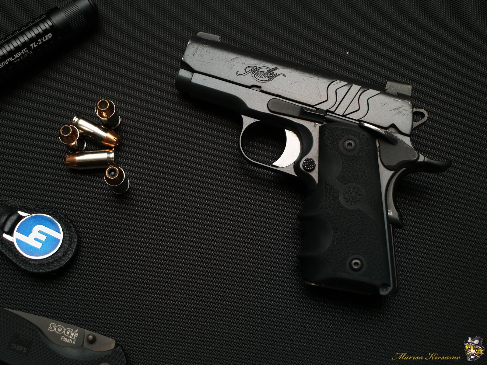 A close-up image of a Kimber pistol beside spent cartridge casings, set against a dark background, designed as a high-definition desktop wallpaper.