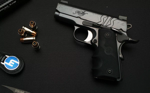 A close-up image of a Kimber pistol beside spent cartridge casings, set against a dark background, designed as a high-definition desktop wallpaper.