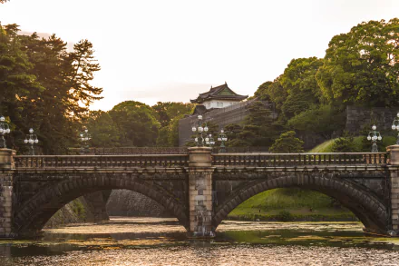 Stone arched bridge over the moat at Tokyo Imperial Palace, Tokyo, Japan — a man-made landmark shown as a 5K Ultra HD PC desktop wallpaper and background.