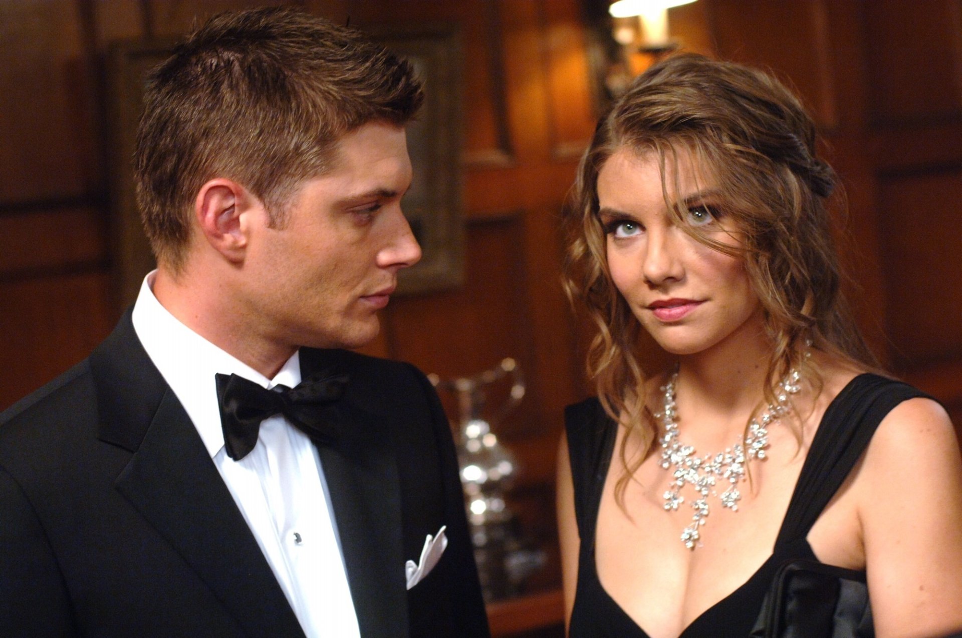 Dean Winchester and Bela Talbot share a moment in this HD wallpaper from the TV show Supernatural, showcasing their intriguing dynamic.