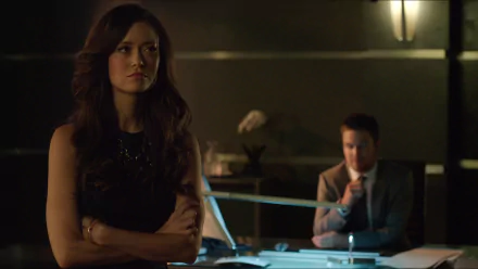 Isabel Rochev and Summer Glau in a dimly lit scene from the TV show Arrow, featured in an HD PC desktop wallpaper and background.