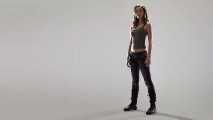 HD PC desktop wallpaper featuring a character from the TV show Terminator: The Sarah Connor Chronicles standing against a plain gray background.