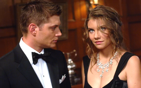 Dean Winchester and Bela Talbot share a moment in this HD wallpaper from the TV show Supernatural, showcasing their intriguing dynamic.