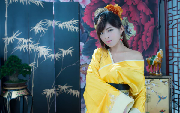 Asian Taiwanese woman in a yellow traditional costume with ornate hair-dress and earrings, posing before a painted floral screen — 5K Ultra HD desktop wallpaper.