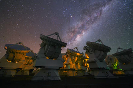 HD PC desktop wallpaper: ESO array of radiotelescopes in Chile's Atacama Desert — man-made telescope dishes glowing beneath the Milky Way.