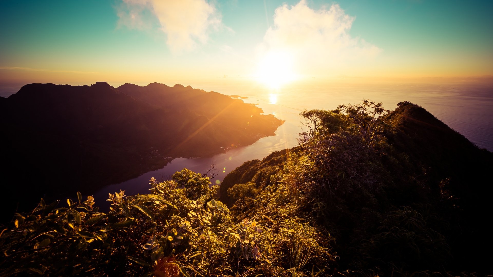 A vibrant sunset over lush mountains and a winding river, captured in stunning 4K Ultra HD quality, showcasing the beauty of nature.