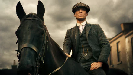 Thomas Shelby, portrayed by Cillian Murphy, exudes a commanding presence while riding a horse against a dramatic sky, showcasing a striking moment from the TV show Peaky Blinders.