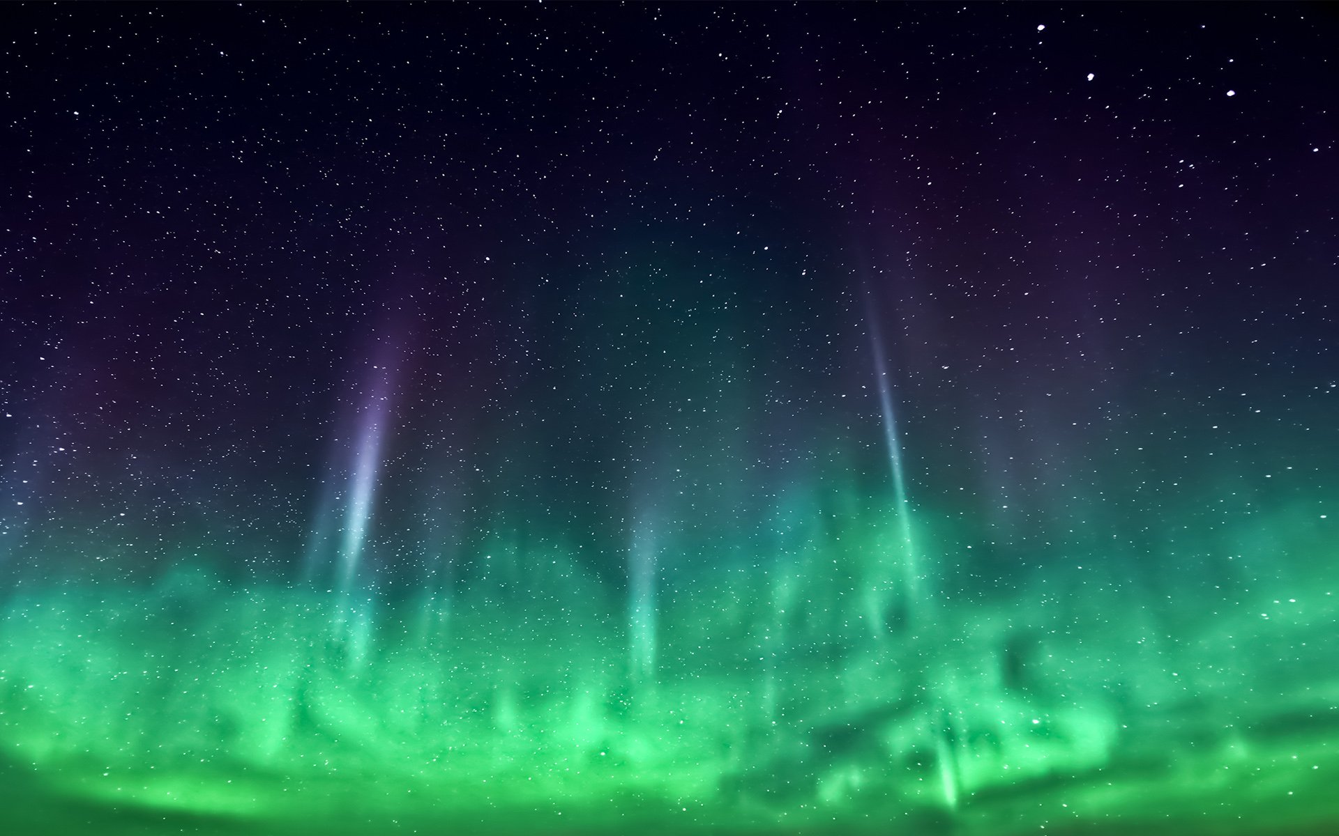 HD PC desktop wallpaper featuring a vibrant green aurora borealis lighting up the night sky over a natural landscape.