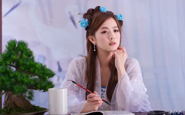 Portrait of an Asian woman in traditional Chinese Taiwanese costume, holding a brush beside a bonsai tree, adorned with hairpins in a 4K Ultra HD desktop wallpaper.