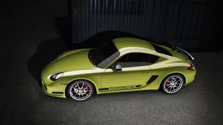 Green Porsche Cayman R sports car captured as an HD desktop wallpaper, showcasing sleek design and vibrant color in a high-quality vehicle image.