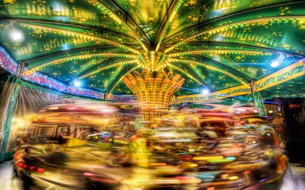 Vibrant motion blur captures a glowing carousel spinning at night in Paris, France, rendered in stunning 4K Ultra HD as a dynamic man-made scene.