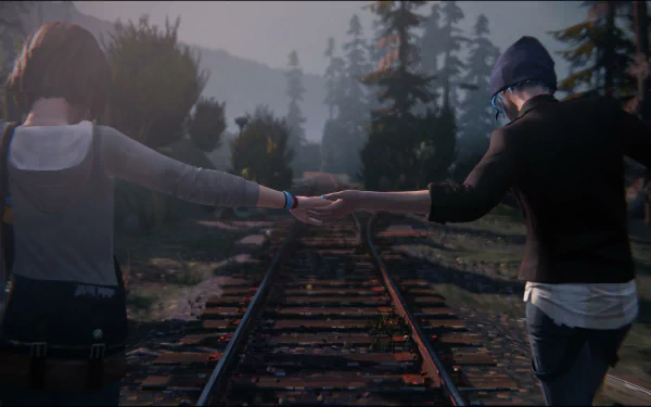 Chloe Price and Max Caulfield from the video game Life Is Strange hold hands while walking on train tracks in this HD desktop wallpaper and background, surrounded by misty trees and mountains.
